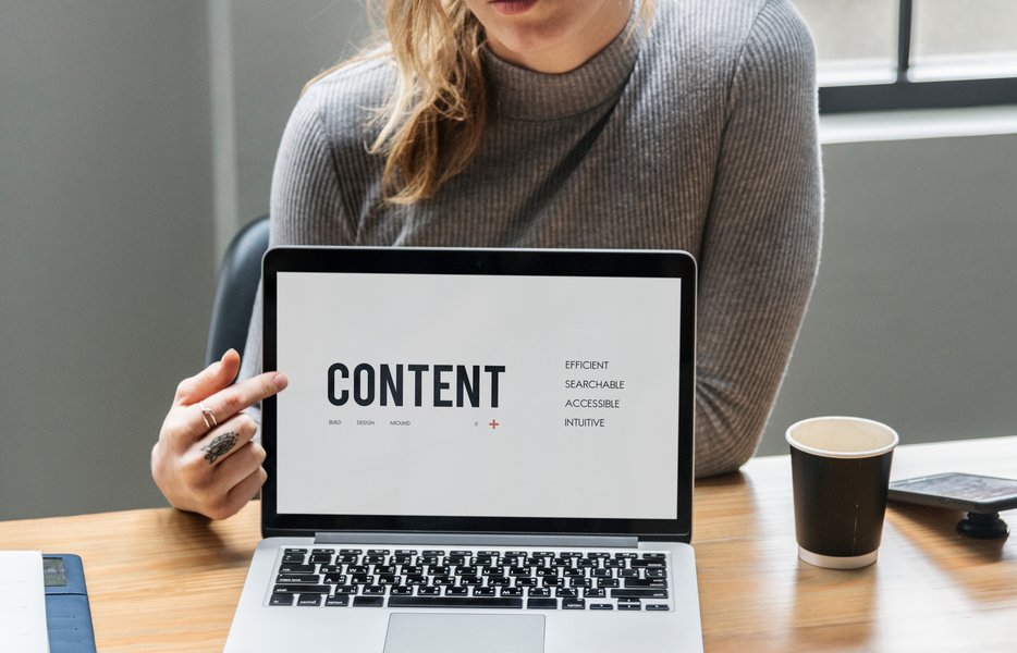 a laptop screen reading 'CONTENT'
